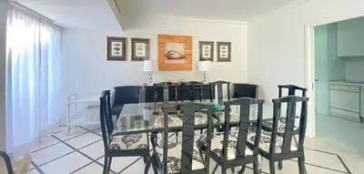 a dining room with a glass table and chairs at Intemporal Duplex Marina T2 HsR Marina Vilamoura in Vilamoura