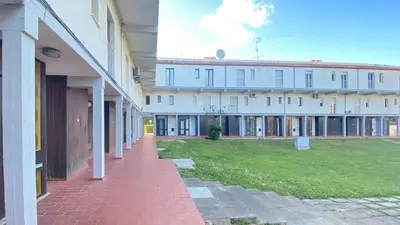 a row of buildings with a lawn in front of them at Intemporal Duplex Marina T2 HsR Marina Vilamoura in Vilamoura