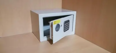 a white microwave oven sitting on top of a floor at Encosta Da Orada in Albufeira
