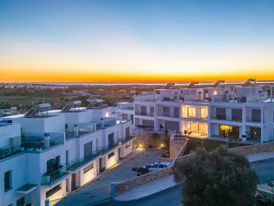 an aerial view of a building at sunset at Townhouse Varadero by Algarve Vacation in Albufeira