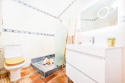 a bathroom with a toilet and a sink at Villa Shangri-La by Algarve Vacation in Albufeira