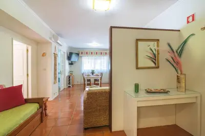 a living room with a couch and a table at Vilamoura M.M. Holidays T2 in Vilamoura