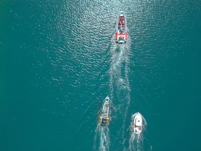 three boats in the water in the ocean at Villa Isla Bella by Algarve Vacation in Albufeira