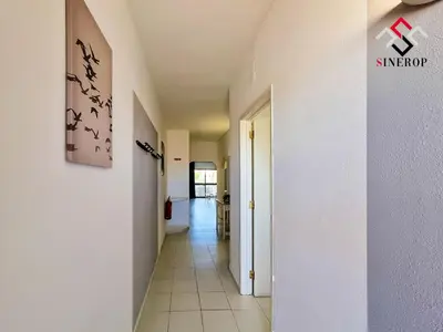 a hallway with a hallway leading to a room at Apartamento T1 - Valmangude in Albufeira