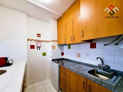 a kitchen with a sink and a counter top at Apartamento T1 - Valmangude in Albufeira