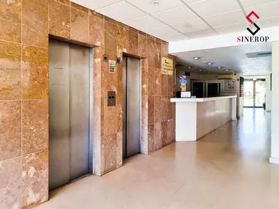 a hallway with three elevators in a building at Apartamento T1 - Valmangude in Albufeira