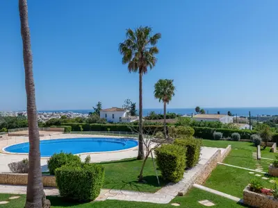a room with two beds and a window at Apartment Aguia M T2 - VIP Properties by Interhome in Albufeira