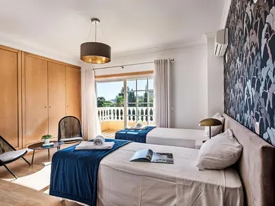 a bedroom with two beds and a wall at Holiday Home Demi - VIP Properties by Interhome in Albufeira