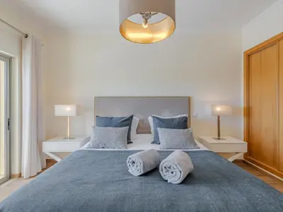 a living room with a couch and a table at Apartment Jardins Marina T2 - VIP Properties by Interhome in Albufeira