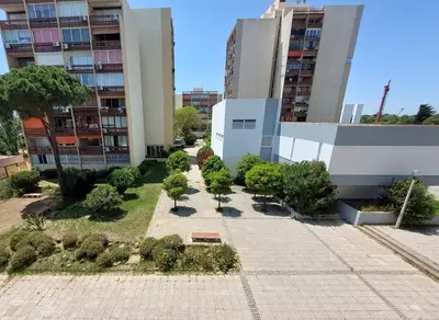 a courtyard of a building with trees and buildings at Loule Turtle by SAPvillas in Vilamoura