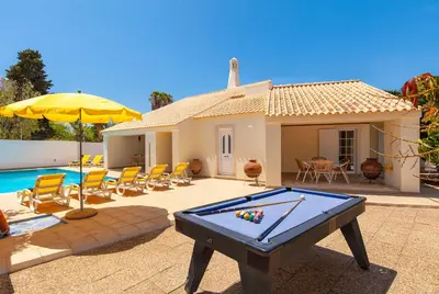 a pool table in front of a house at Villa Las Palmas by Algarve Vacation in Albufeira