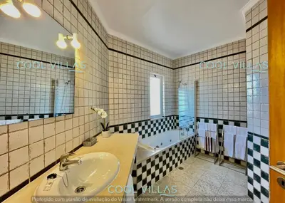 a bathroom with a sink and a bath tub at Orquidea Senses - 6 Pax - Sea View in Albufeira