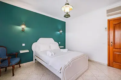 a pool table in a living room with at VILLA LINDA Palace in Guia