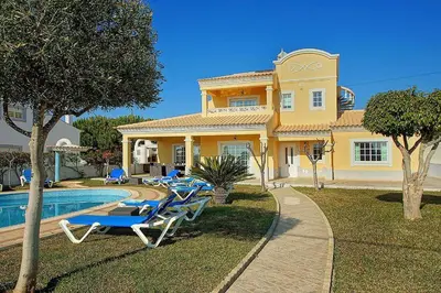a pool table in a living room with at VILLA LINDA Palace in Guia