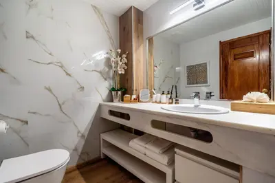 a bathroom with a sink and a toilet at Deluxe Flat by Albufeira Holidays in Albufeira
