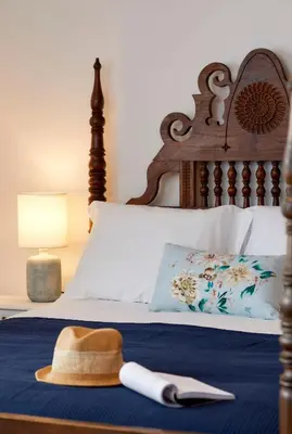 a bed with a hat and a hat at Apartments in Albufeira - Old Town in Albufeira