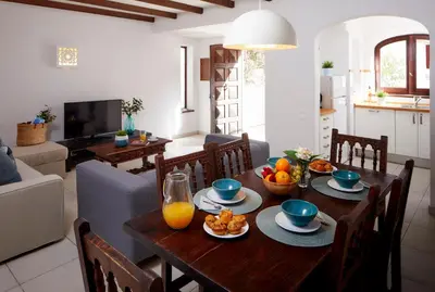 a living room with a wooden table with fruit on it at Apartments in Albufeira - Old Town in Albufeira