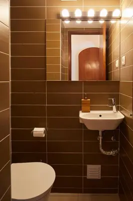 a bathroom with a sink and a toilet and a mirror at Apartments in Albufeira - Old Town in Albufeira