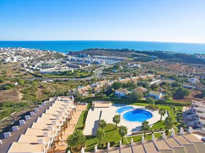 an aerial view of a resort with a swimming pool at Fantastic Townhouse with Pool and Sea Views in Albufeira