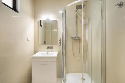 a bathroom with a sink and a shower at Amazing Flat In Olhos de Água in Olhos de Água
