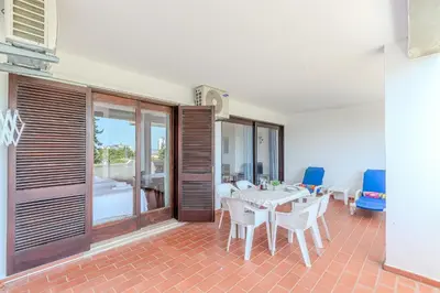 a dining room with a table and chairs at Apartamento LIMA by Sunnyway in Albufeira