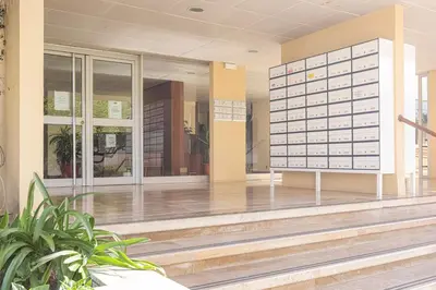 an empty lobby of a building with glass doors at MARC - Vilamoura in Vilamoura