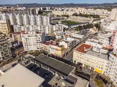 an aerial view of a city with tall buildings at Modern & Cozy Faro Mercado Apt 11 by Lisbeyond in Faro