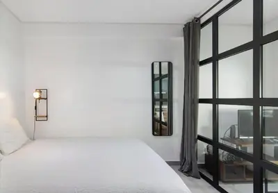 a bedroom with a white bed and a window at Cosy Loft in Vilamoura in Vilamoura