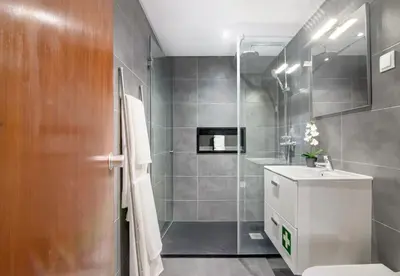 a bathroom with a toilet and a sink and a shower at Cosy Loft in Vilamoura in Vilamoura