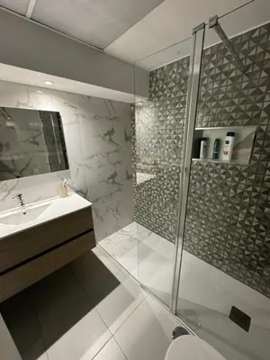 a bathroom with a shower and a sink at Newly refurbished 2 bed appt Vilamoura in Vilamoura
