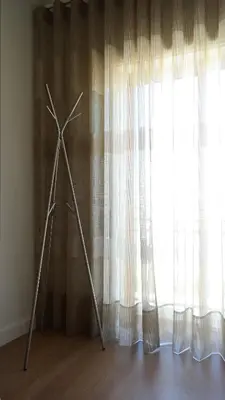 a windmill standing in front of a window at Vila Atlantida Apartment in Vilamoura