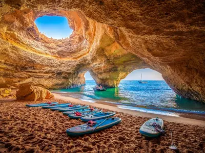 a group of kayaks lined up on the beach at Luxury Holiday Villa Pescadinha near Beach, Albufeira in Albufeira