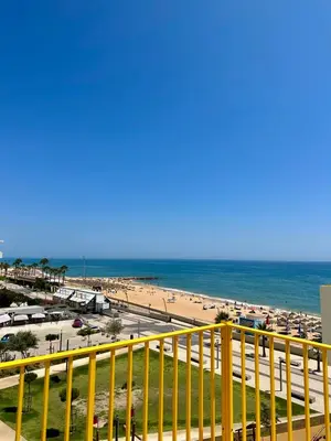 a view of the beach from the balcony of a condo at TOM's House - T2 Sea View in Quarteira