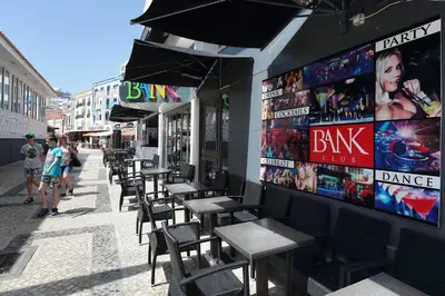 a row of tables and chairs outside of a restaurant at Original Studio Downtown in Albufeira