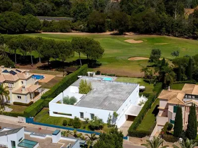 an aerial view of a house and a golf course at Villa Laguna 25 by Stay ici Algarve Holiday Rental in Quarteira
