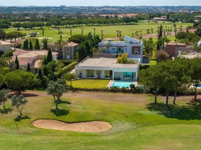 an aerial view of a house and a golf course at Villa Laguna 25 by Stay ici Algarve Holiday Rental in Quarteira