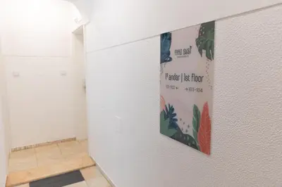 a room with a poster on the wall at Faro Guest Apartments in Faro