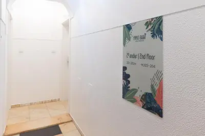 a sign on a wall in a room at Faro Guest Apartments in Faro