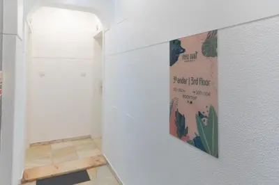 a hallway with a poster on the wall at Faro Guest Apartments in Faro