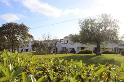 a view of a house from the bushes at Excellent 1 Bedroom Villa - em Clube Albufeira Garden Village in Albufeira