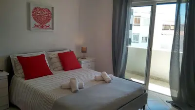 a bedroom with a bed with two teddy bears on it at Apartamentos Monica in Quarteira