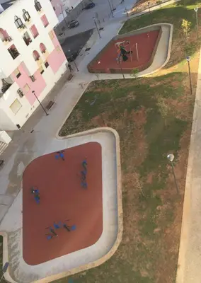 an overhead view of a skate park with a skateboard ramp at Quarteira Paul Harris Apartment in Quarteira