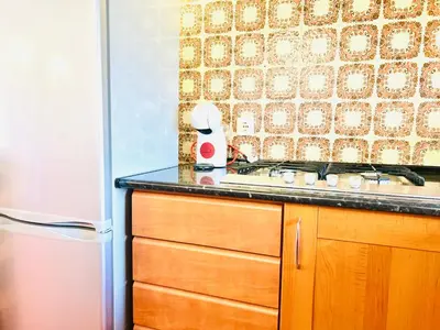 a kitchen with a sink and a counter top at Point Apartament Praia da Oura in Albufeira