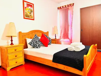 a bedroom with a bed with two towels on it at Point Apartament Praia da Oura in Albufeira