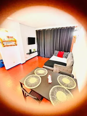 a living room with a table and a couch at Point Apartament Praia da Oura in Albufeira