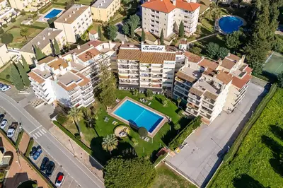 an aerial view of a residential estate with a swimming pool at Tasteful 1 BDR Flat W/Balcony & Pool by LovelyStay in Quarteira