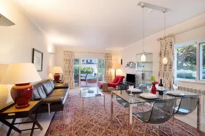 a living room with a couch and a table at Bia in Almancil