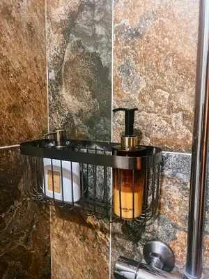 a bathroom with a soap dispenser on a wall at Grand Studio 54 in Faro
