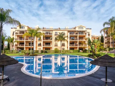 a view of the resort from the pool at Apartment Triplex Vilamoura VIP Properties by Interhome in Vilamoura