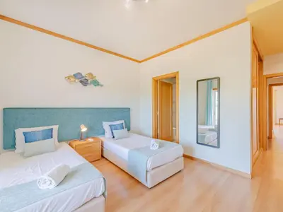 a living room with a couch and a table at Holiday Home Cerro Aguia AM V2 - VIP Properties by Interhome in Albufeira